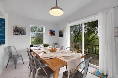 a dining room with a wooden table and chairs at Large House On Horsetooth Reservoir - Great Views! in Fort Collins