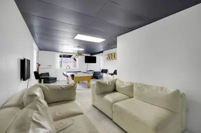 a living room with couches and a pool table at Large House On Horsetooth Reservoir - Great Views! in Fort Collins