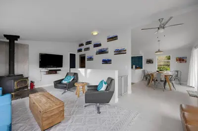 a living room filled with furniture and a tv at Large House On Horsetooth Reservoir - Great Views! in Fort Collins