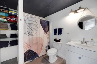 a bathroom with a toilet and a sink at Large House On Horsetooth Reservoir - Great Views! in Fort Collins