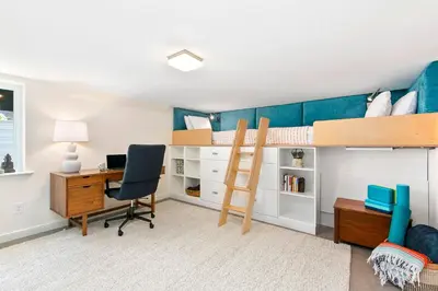 a bedroom with a desk and a bunk bed at Maple Courtyard - Old Town with King Suite & Piano in Fort Collins