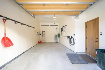 an empty garage with a guitar hanging on the wall at Cloudline Chalet townhouse in Winter Park