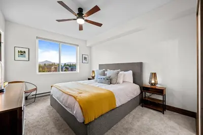 a bedroom with a bed and a ceiling fan at 281 W Meadow Mile #4 in Fraser