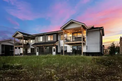 a large house with a sunset in the background at 281 W Meadow Mile #4 in Fraser
