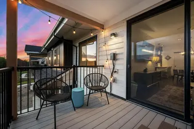 a balcony of a house with two chairs and a table at 281 W Meadow Mile #4 in Fraser