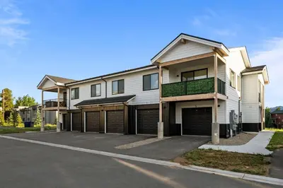 a white house with a garage at 281 W Meadow Mile #4 in Fraser