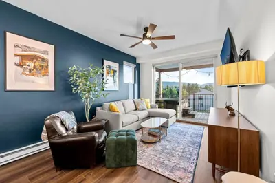 a living room with a couch and a ceiling fan at 281 W Meadow Mile #4 in Fraser