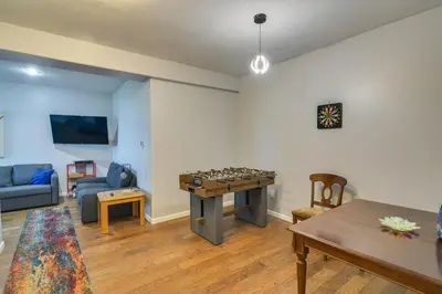 a living room with a chess table and a couch at Mountain-View Conifer Gem Near Hiking and Fishing in Conifer
