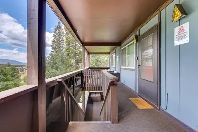 a balcony of a train with a view of the mountains at Dine, Shop and Shuttle to Resort Winter Park Haven! in Winter Park