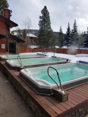 a hot tub on top of a wooden deck at Mountainside Retreat - Sleeps 4 in Frisco