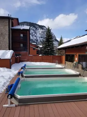 a pool on a deck with snow on the ground at Mountainside Retreat - Sleeps 4 in Frisco