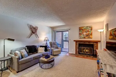 a living room with a couch and a fireplace at Mountainside Retreat - Sleeps 4 in Frisco