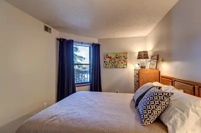 a bedroom with a bed and a window at Mountainside Retreat - Sleeps 4 in Frisco