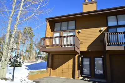a house with a balcony on the side of it at Our Mountain Blessings Condominium Town Home - peaceful, cozy, and family friendly mountain getaway! The most ideally located unit in Meadow Ridge Resort, in Fraser