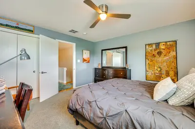 a bedroom with a bed and a ceiling fan at Mtn-View Home with Pickleball Court in Louisville! in Louisville