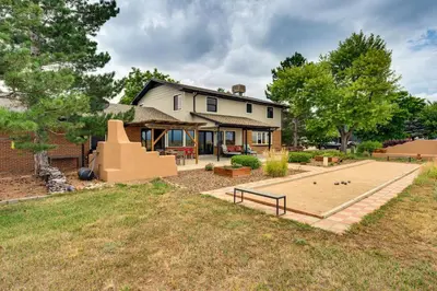 a house with a backyard with a basketball court at Mtn-View Home with Pickleball Court in Louisville! in Louisville