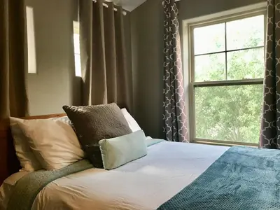 a bedroom with a bed with a pillow and a window at Summit Vista Villa- Hike, Ski, Bike! in Fraser