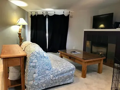 a living room with a couch and a coffee table at Summit Vista Villa- Hike, Ski, Bike! in Fraser