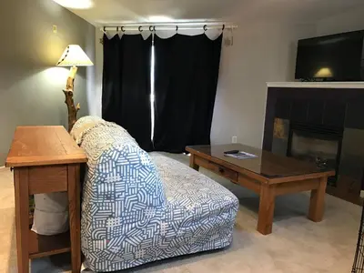 a living room with a couch and a table at Summit Vista Villa- Hike, Ski, Bike! in Fraser