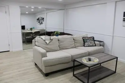a living room with a couch and a table at Large Guest Suite with Private-Cozy-Central 1-BD 1-BT & Kitchen in Greenwood Village