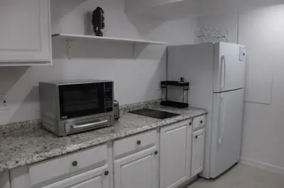 a kitchen with a microwave and a refrigerator at Large Guest Suite with Private-Cozy-Central 1-BD 1-BT & Kitchen in Greenwood Village