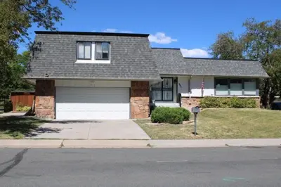 a house with a garage on the side of a street at Large Guest Suite with Private-Cozy-Central 1-BD 1-BT & Kitchen in Greenwood Village