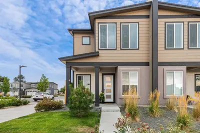 a house in a subdivision with a driveway at 10 min to DT, Luxe 4BR w Movie Theater, Game Room in Commerce City