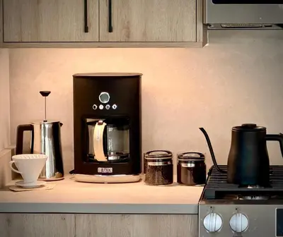 a coffee maker on a counter in a kitchen at Luxury modern, Central Ski, No stairs, EV! in Silverthorne