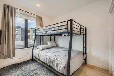 a bedroom with two bunk beds and a window at River West 822 in Silverthorne