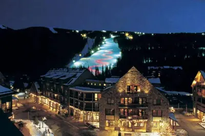 a view of a town at night with a mountain at River West 822 in Silverthorne