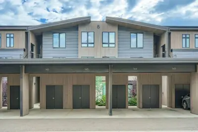 a large house with a lot of garage at River West 822 in Silverthorne