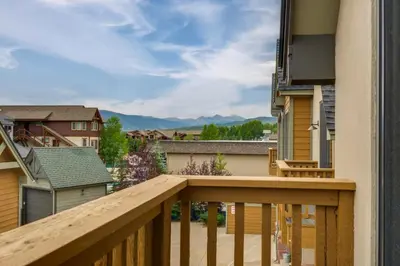 a balcony with a view of the mountains at Patio with Peak 1 Mtn View Main Street Frisco Condo in Frisco