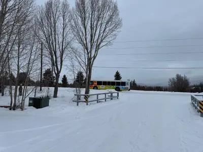 a bus is parked in a snow covered field at Condo 2BR on Winter Park Ski Bus Route for Christmas in Fraser