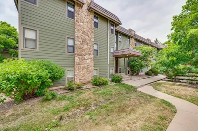 a green house with a sidewalk in front of it at 2 Mi to CU Boulder Mtn-View Condo with Pool Access in Boulder