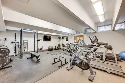 a gym with several treadmills and exercise machines at 2 Mi to CU Boulder Mtn-View Condo with Pool Access in Boulder