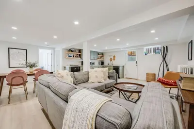 a living room with a couch and a table at Cozy Garden Suite by Sloan's Lake and Tennyson! in Wheat Ridge