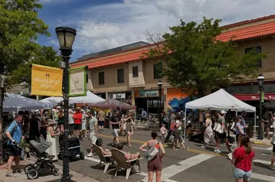 a crowd of people walking in a busy city street at Cozy Garden Suite by Sloan's Lake and Tennyson! in Wheat Ridge