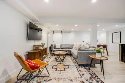 a living room with a couch and chairs at Cozy Garden Suite by Sloan's Lake and Tennyson! in Wheat Ridge