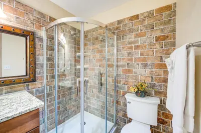 a bathroom with a glass shower and a toilet at Walk to Ski Shuttle Dtwn Frisco Gem with Fireplace! in Frisco