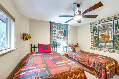a bedroom with two beds and a ceiling fan at Walk to Ski Shuttle Dtwn Frisco Gem with Fireplace! in Frisco