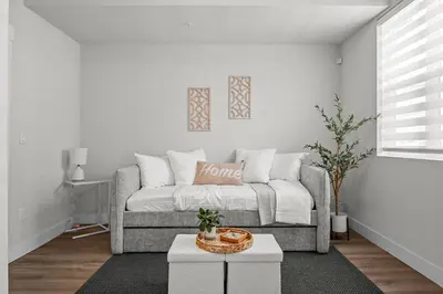 a living room with a couch and a table at 3534 W 63rd Ave in Denver