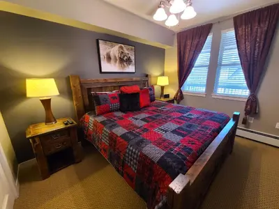a bedroom with a bed and a window at Platinum Top Floor Ski-in Ski-out WP Resort in Winter Park