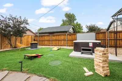 a backyard with a barbecue grill and a lawn at 5280 Oasis - Hot Tub Walk to Sloan's Lake in Denver