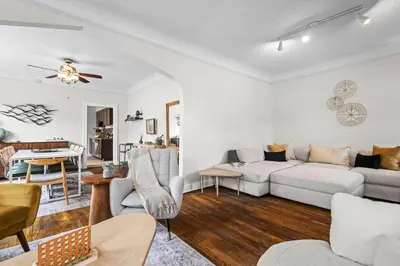 a living room with a couch and a table at 5280 Oasis - Hot Tub Walk to Sloan's Lake in Denver