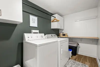 a laundry room with a washer and dryer at 5280 Oasis - Hot Tub Walk to Sloan's Lake in Denver