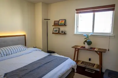 a bedroom with a bed and a window at Dog Friendly Oasis Private Hot Tub with Sauna in Boulder
