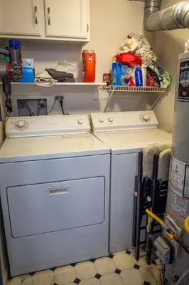 a washer and dryer in a small kitchen at Dog Friendly Oasis Private Hot Tub with Sauna in Boulder