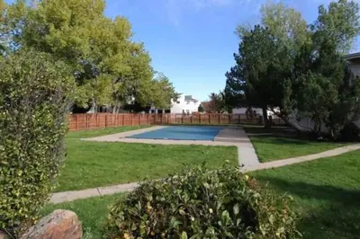 a yard with a swimming pool and trees at Dog Friendly Oasis Private Hot Tub with Sauna in Boulder