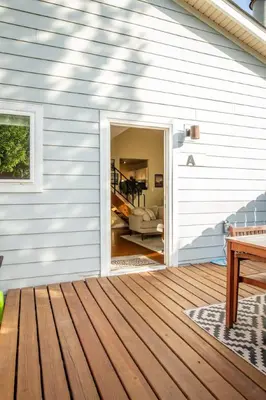 an open door to a house with a deck at Dog Friendly Oasis Private Hot Tub with Sauna in Boulder