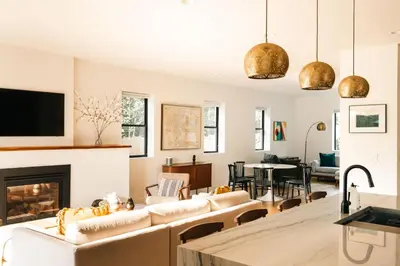 a living room with couches and a fireplace at Colorful Sunnyside Escape - Walk to Dining & Parks in Denver